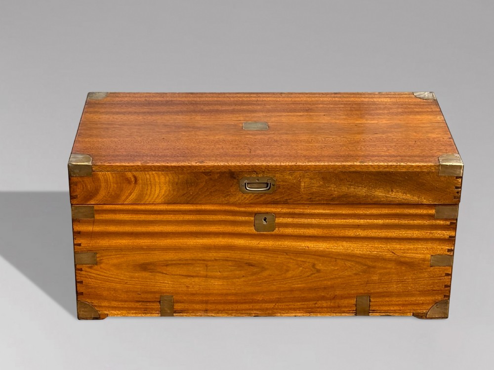 A rectangular 19th-century camphor wood campaign trunk featuring flush brass corner brackets, recessed side handles, and a central brass lock plate. View II