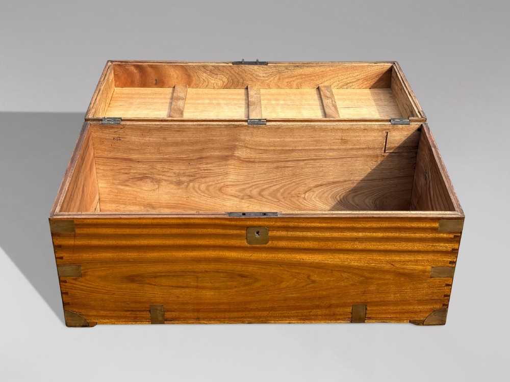 A rectangular 19th-century camphor wood campaign trunk featuring flush brass corner brackets, recessed side handles, and a central brass lock plate. View III