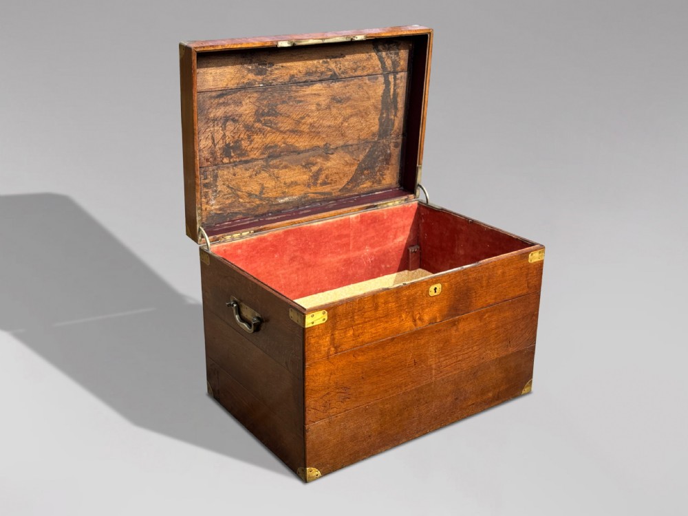 A large rectangular 19th-century oak travelling trunk featuring brass corner mounts, drop side handles, and an inlaid lid cartouche. View III