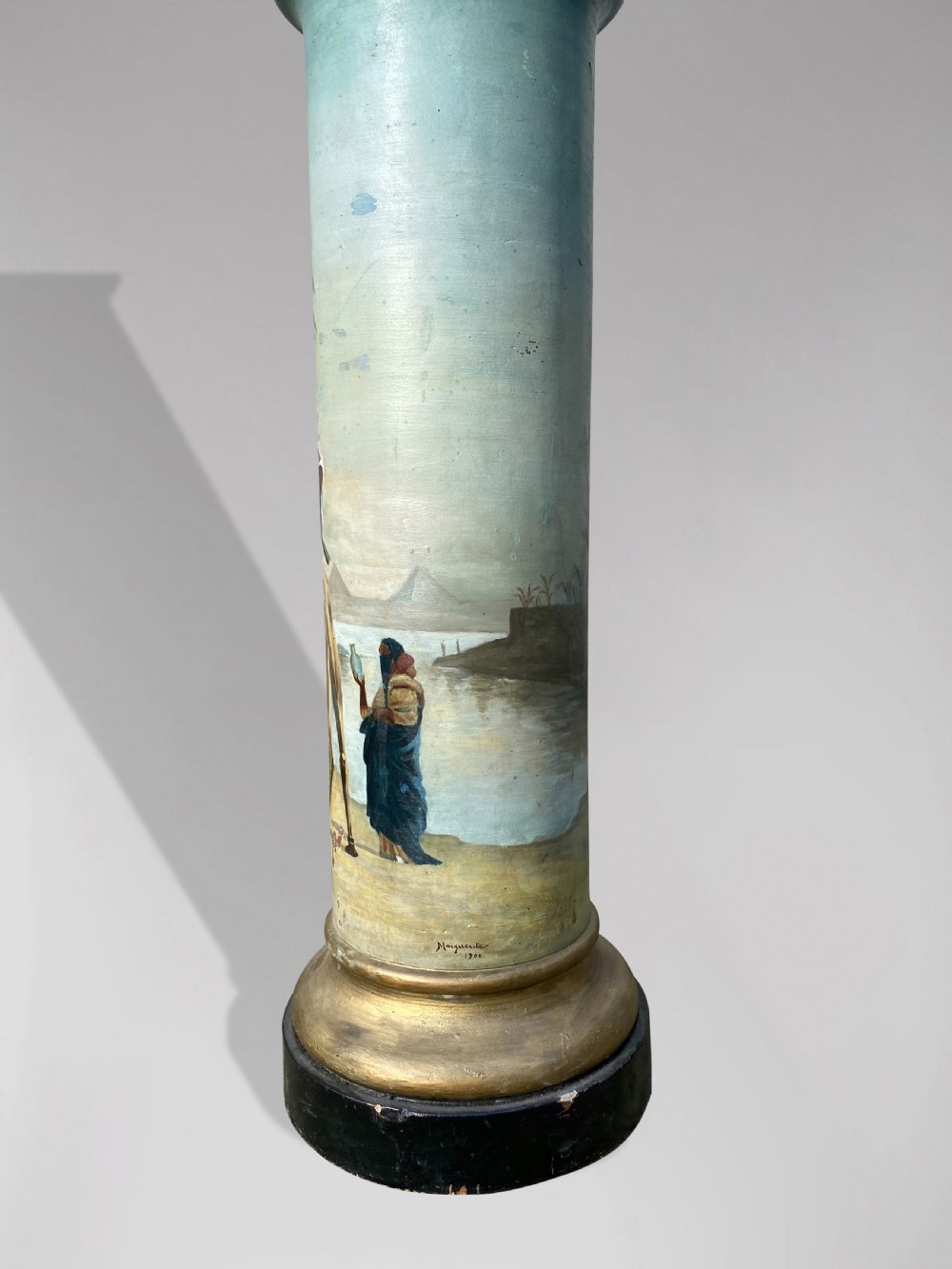 A pair of 19th-century French hand-painted cylindrical wooden columns featuring narrative desert and riverbank scenes above turned gilded bases. View IV