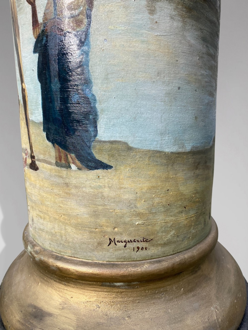 A pair of 19th-century French hand-painted cylindrical wooden columns featuring narrative desert and riverbank scenes above turned gilded bases. View VI