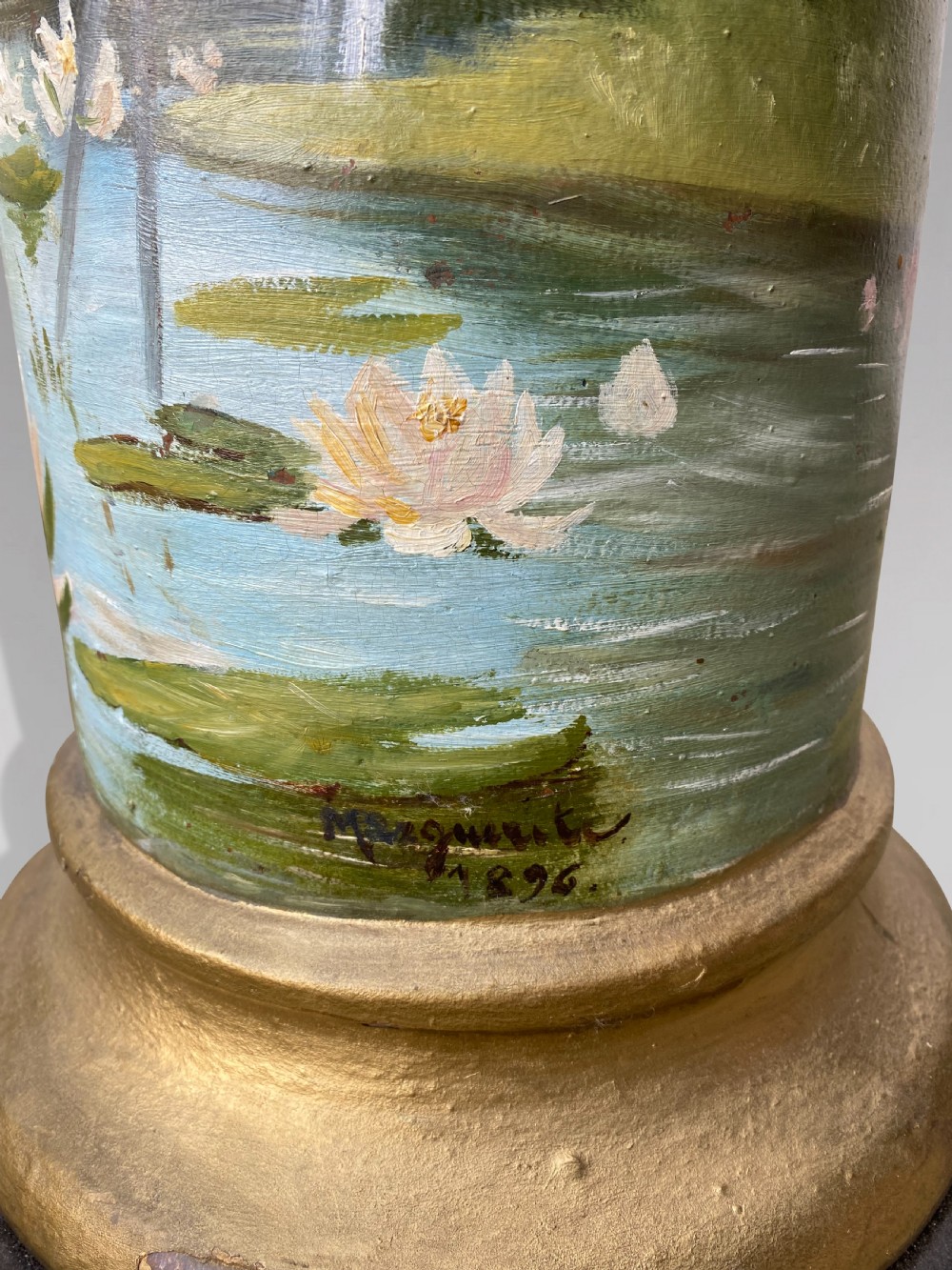 A pair of 19th-century French hand-painted cylindrical wooden columns featuring narrative desert and riverbank scenes above turned gilded bases. View VIII