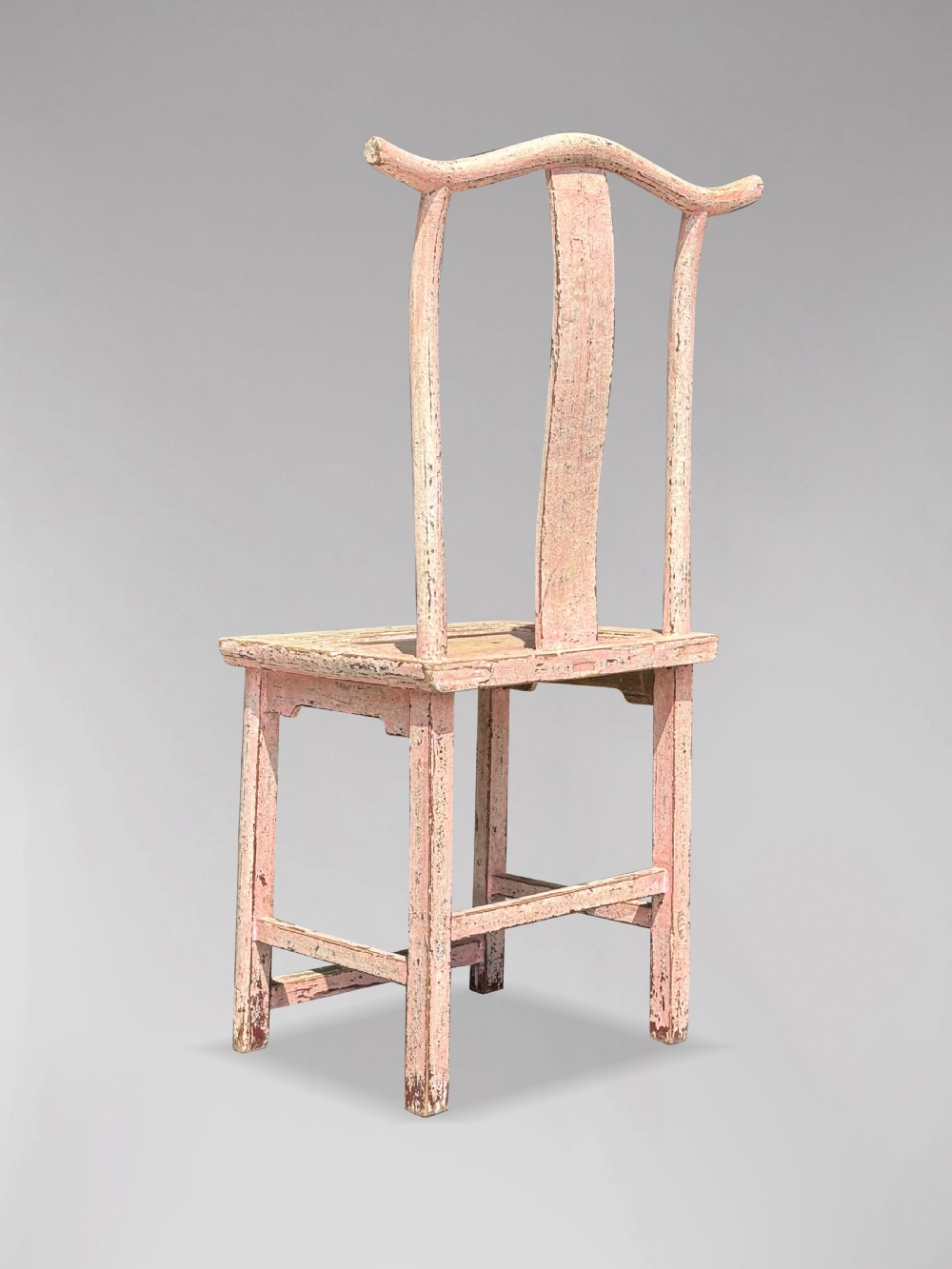 A pair of 19th-century Chinese yoke-back side chairs featuring a distressed pale pink painted finish, curved top rails, and central vertical back splats. View VI