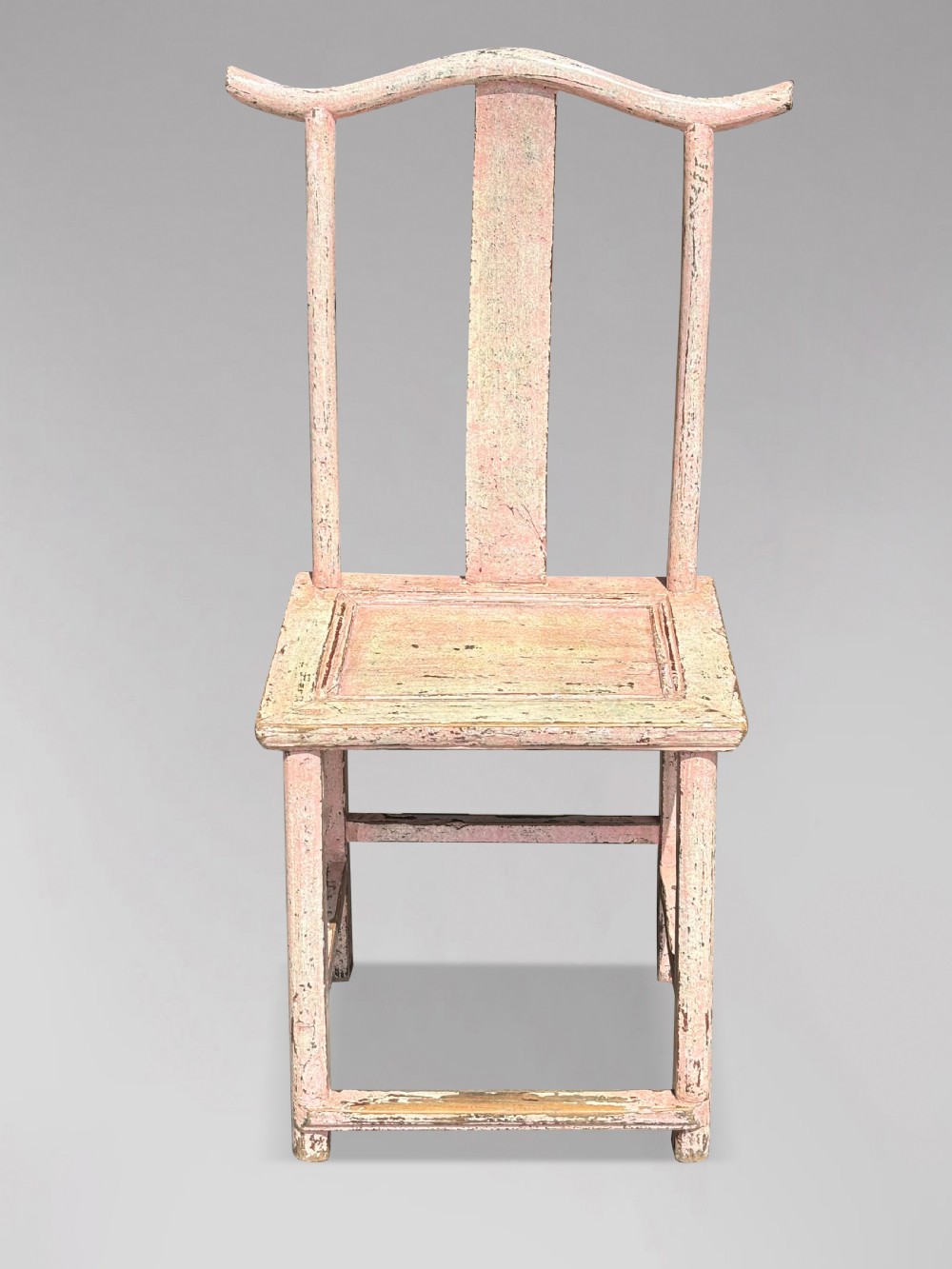 A pair of 19th-century Chinese yoke-back side chairs featuring a distressed pale pink painted finish, curved top rails, and central vertical back splats. View X