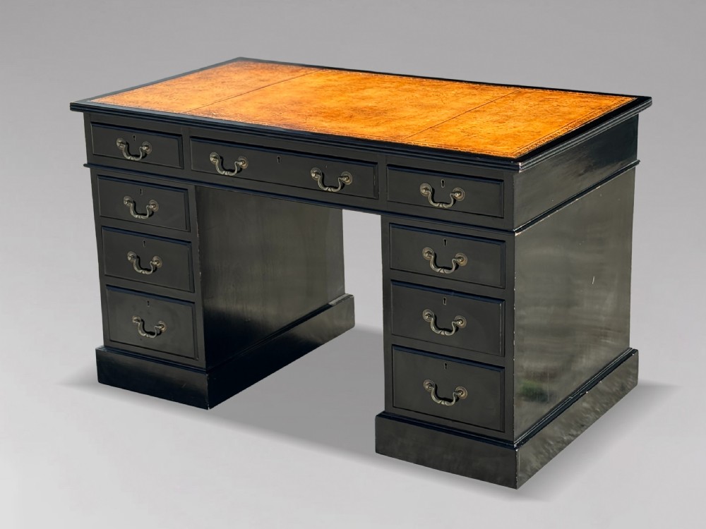 A 19th-century ebonised mahogany pedestal desk featuring a tan tooled leather inset top and brass swan-neck handles. View III