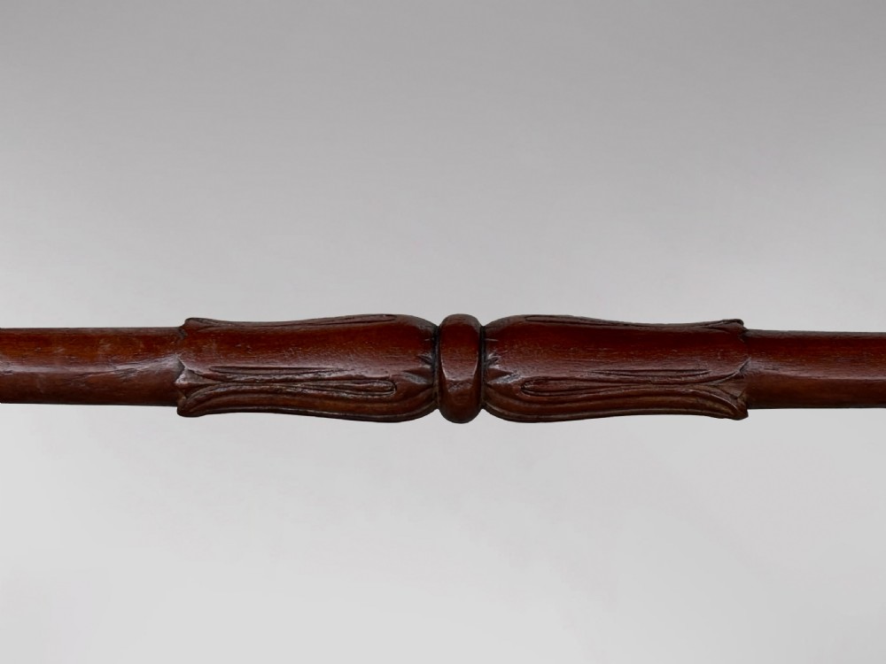 A 19th-century William IV mahogany writing table featuring a dark leather inset top, frieze drawers, carved trestle supports, and scroll feet. View VIII