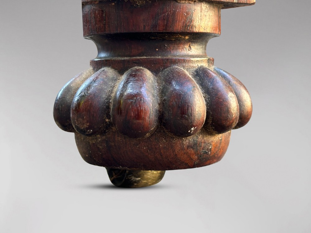 A 19th-century William IV rosewood fold-over card table featuring a gadrooned rim, a turned column stem, and a concave platform base with carved feet. View X