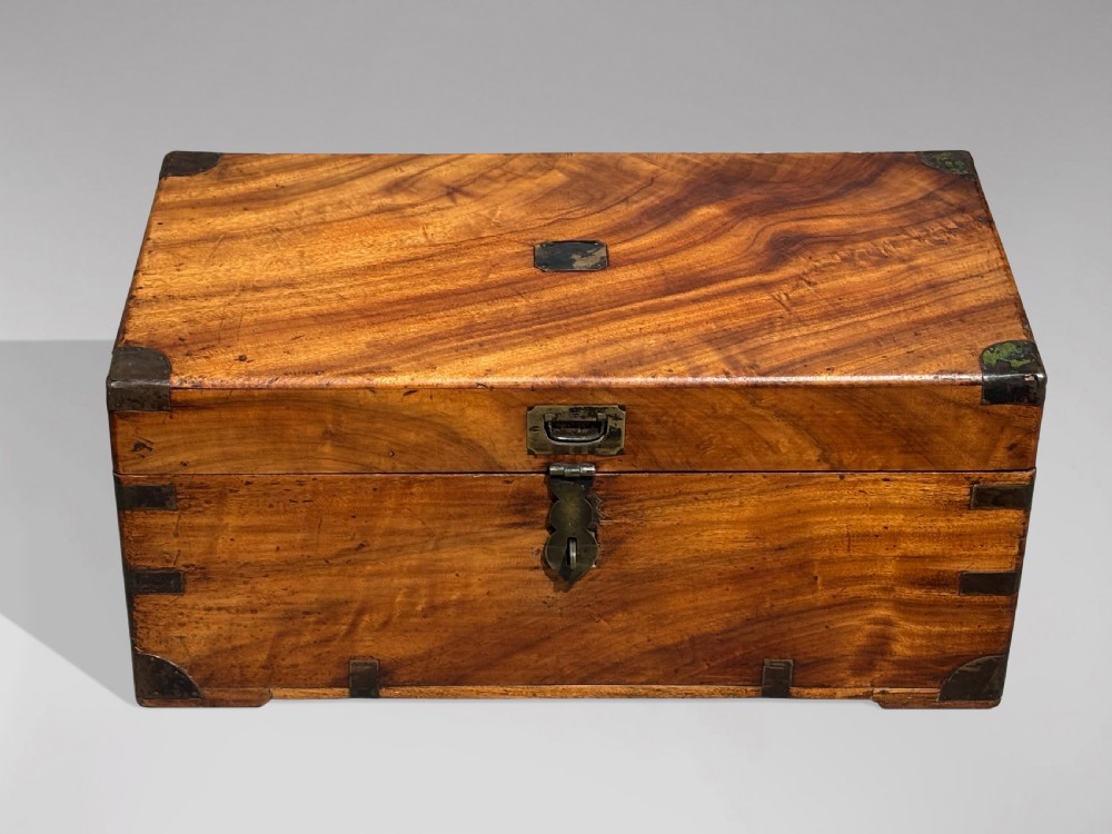 A 19th-century rectangular camphor wood campaign trunk with brass corner fittings and side carrying handles. View II