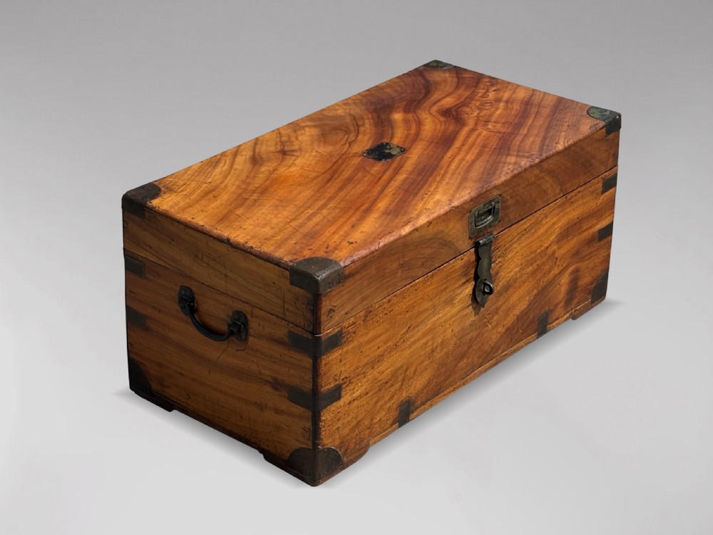 A 19th-century rectangular camphor wood campaign trunk with brass corner fittings and side carrying handles. View X