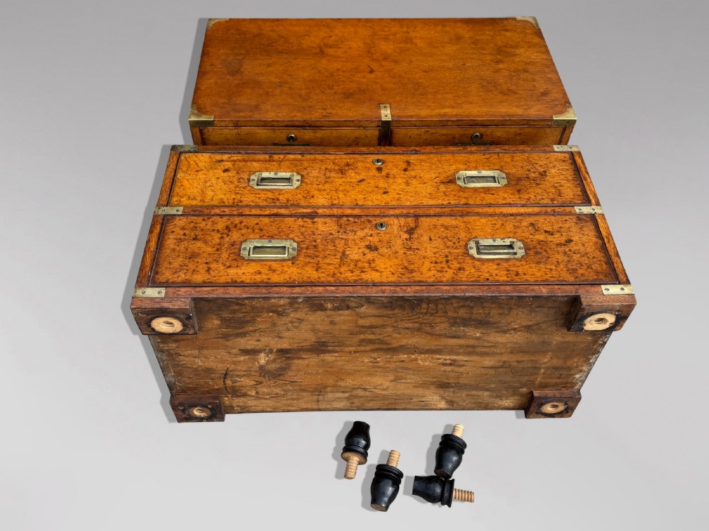 A nineteenth-century oak military campaign chest of drawers featuring brass corner straps, recessed flush handles, and turned feet. View VIII