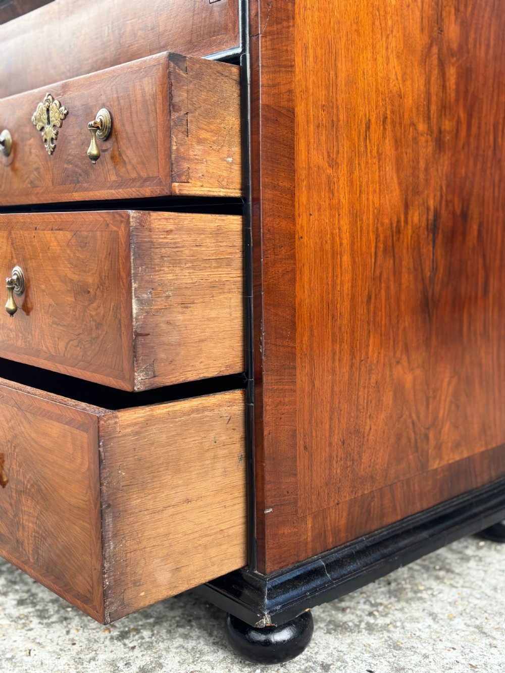 An 18th-century George I walnut bureau bookcase featuring arched panelled upper doors, a slant-front desk, and graduated lower drawers. View XI