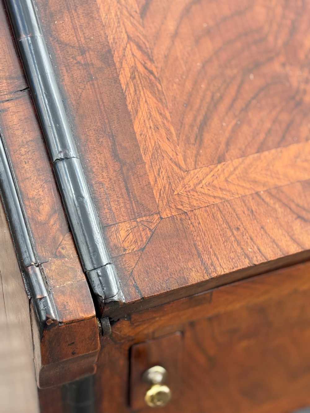 An 18th-century George I walnut bureau bookcase featuring arched panelled upper doors, a slant-front desk, and graduated lower drawers. View XIII