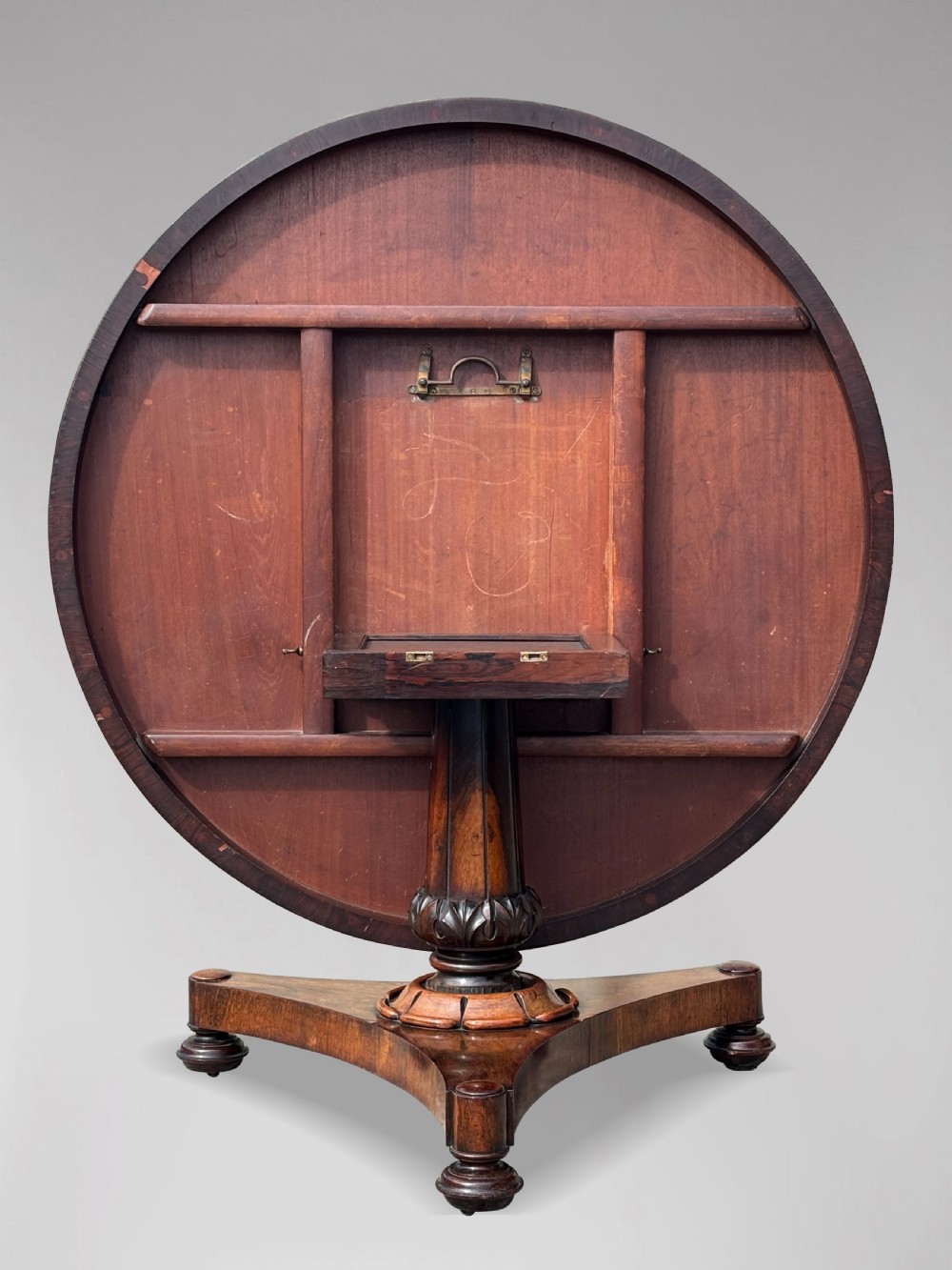 An early 19th-century William IV circular tilt-top centre table constructed from figured rosewood with a triform base. View VI
