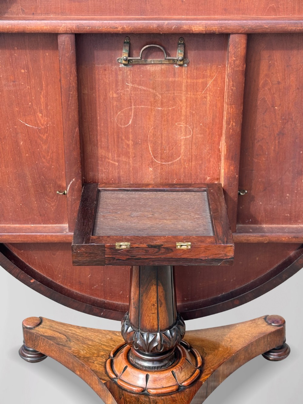 An early 19th-century William IV circular tilt-top centre table constructed from figured rosewood with a triform base. View VIII