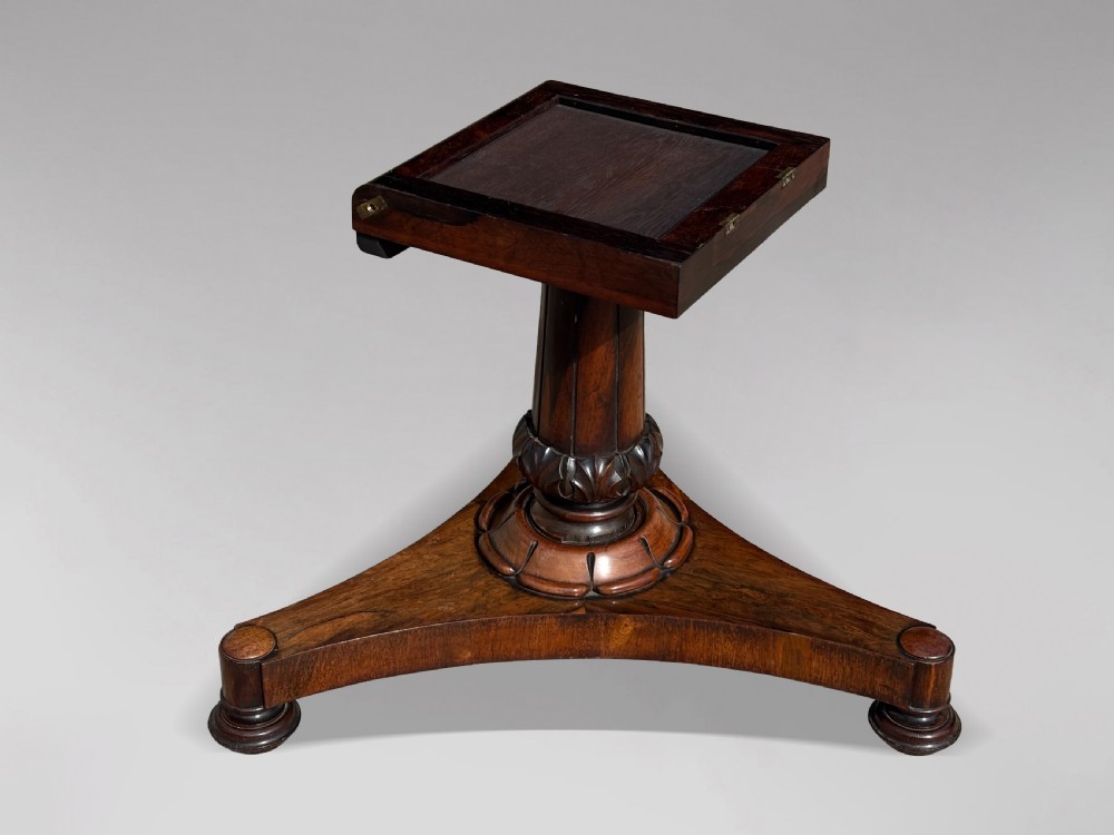 An early 19th-century William IV circular tilt-top centre table constructed from figured rosewood with a triform base. View XI