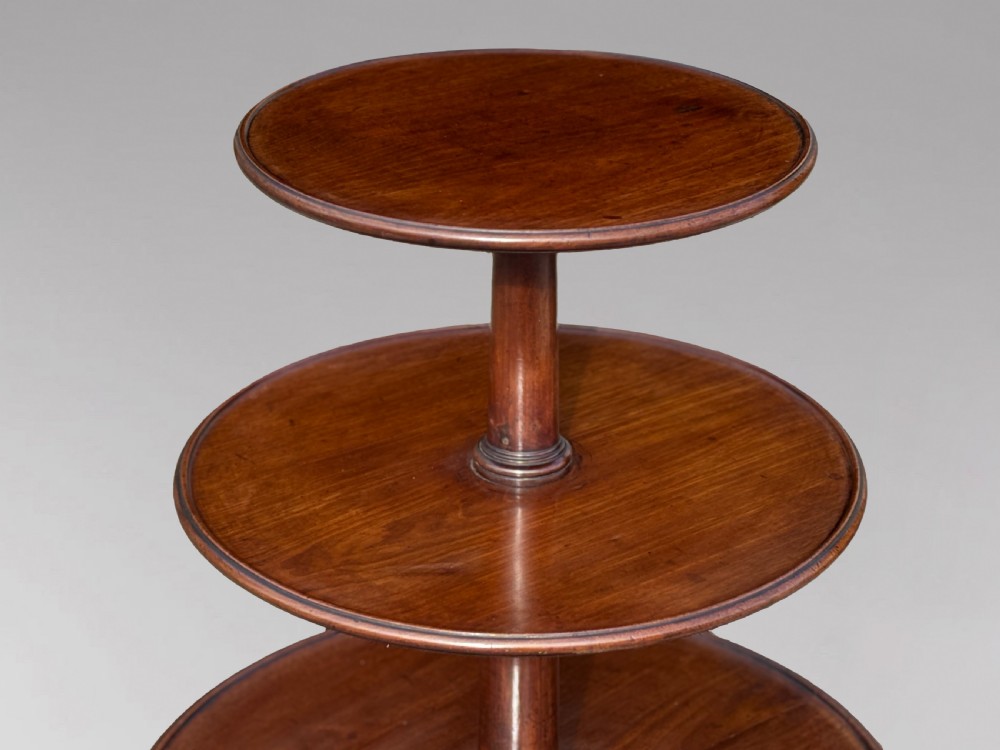 An 18th-century George III mahogany dumb waiter featuring three graduated circular tiers supported by turned columns on a tripod base. View II