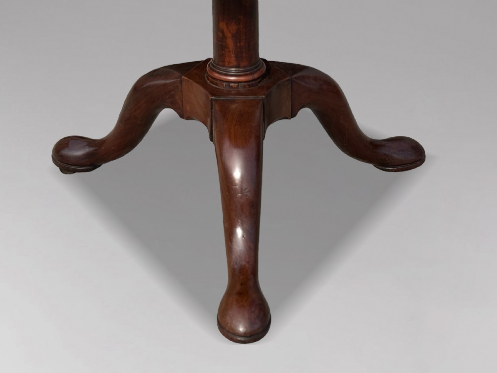 An 18th-century George III mahogany dumb waiter featuring three graduated circular tiers supported by turned columns on a tripod base. View VI