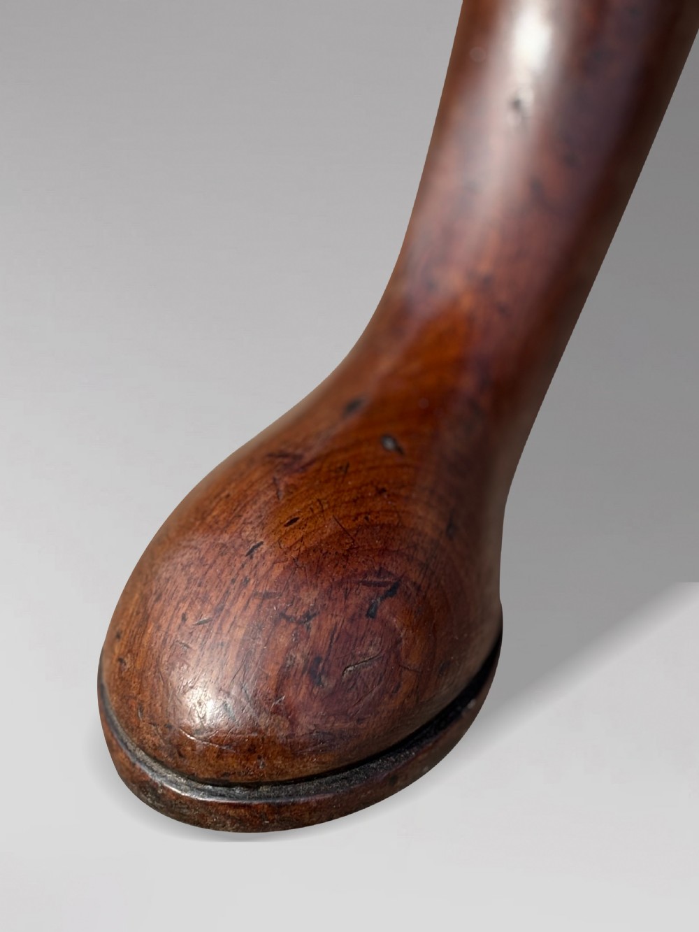 An 18th-century George III mahogany dumb waiter featuring three graduated circular tiers supported by turned columns on a tripod base. View VII