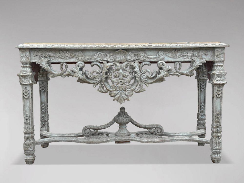 A carved Louis XIV style grey painted console table with an intricate aproned skirt, stretcher base, and faux marble top. View III