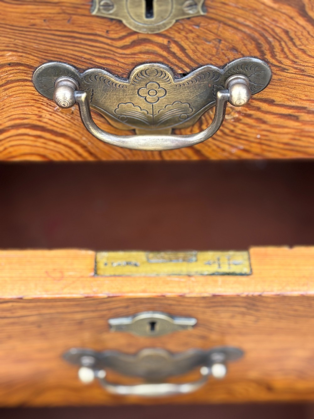 A Victorian pitch pine partners desk featuring a green leather inset writing surface, twin pedestals, and brass swan-neck handles. View VI