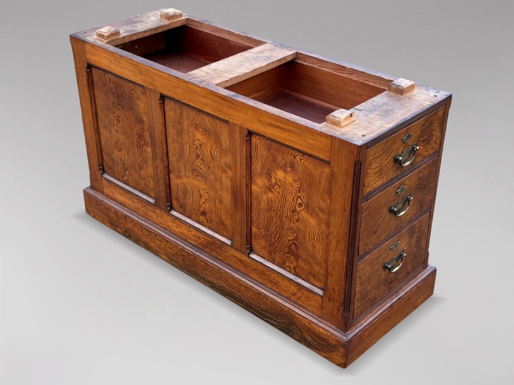 A Victorian pitch pine partners desk featuring a green leather inset writing surface, twin pedestals, and brass swan-neck handles. View IX