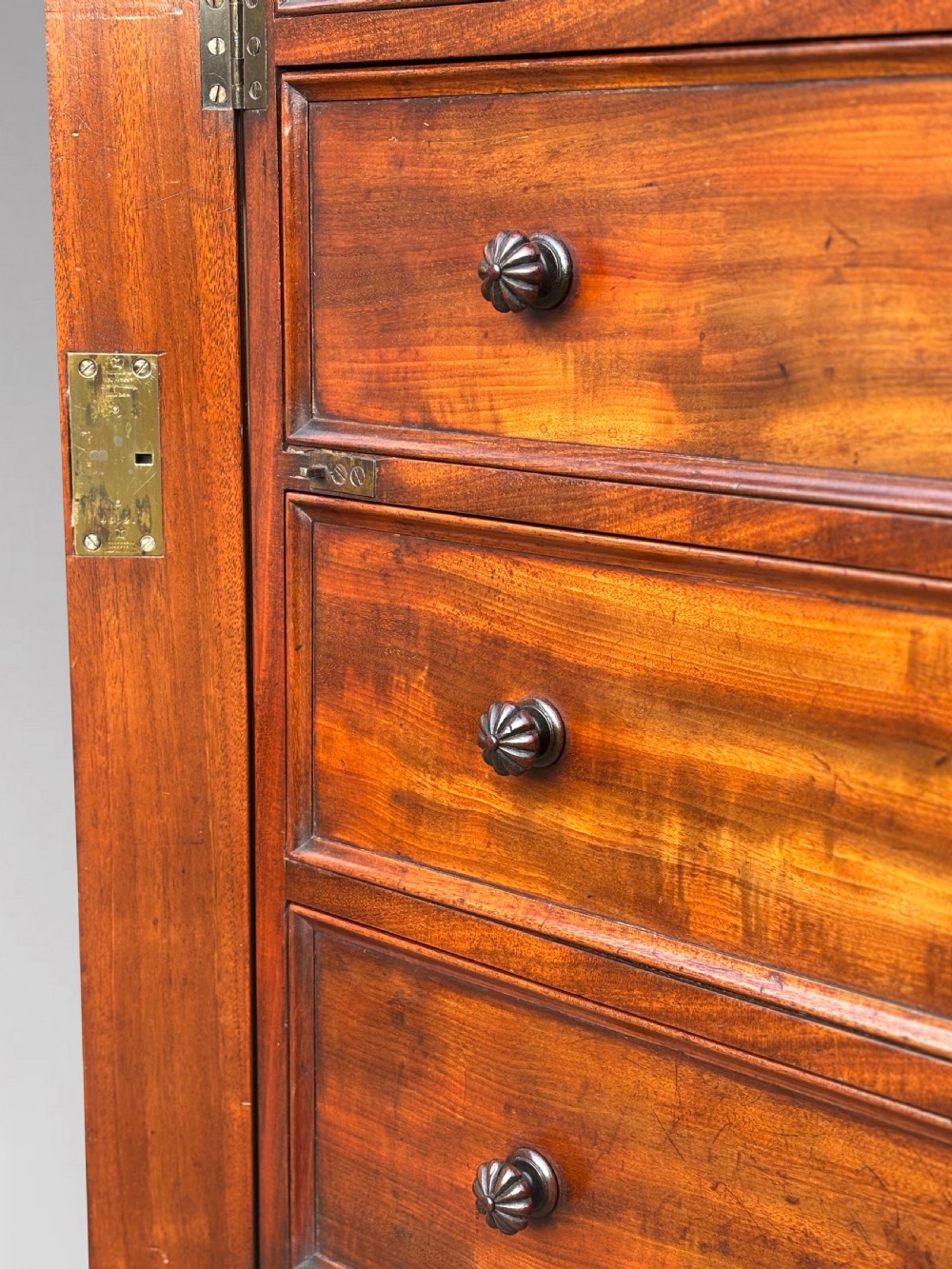 A nineteenth-century mahogany open library bookcase featuring a Wellington chest base with ten small drawers and open adjustable upper shelves. View IX