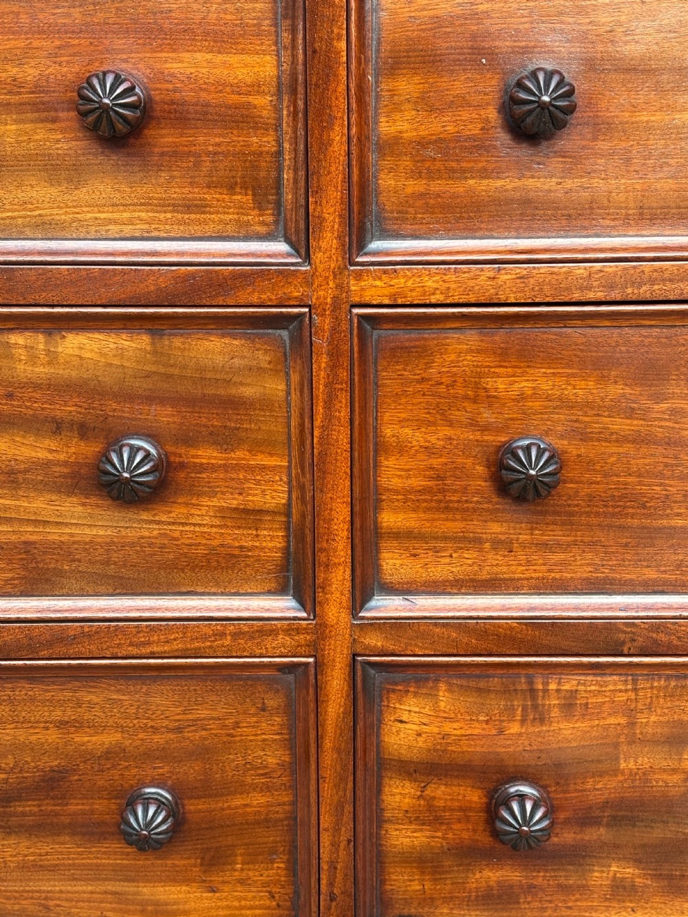 A nineteenth-century mahogany open library bookcase featuring a Wellington chest base with ten small drawers and open adjustable upper shelves. View X
