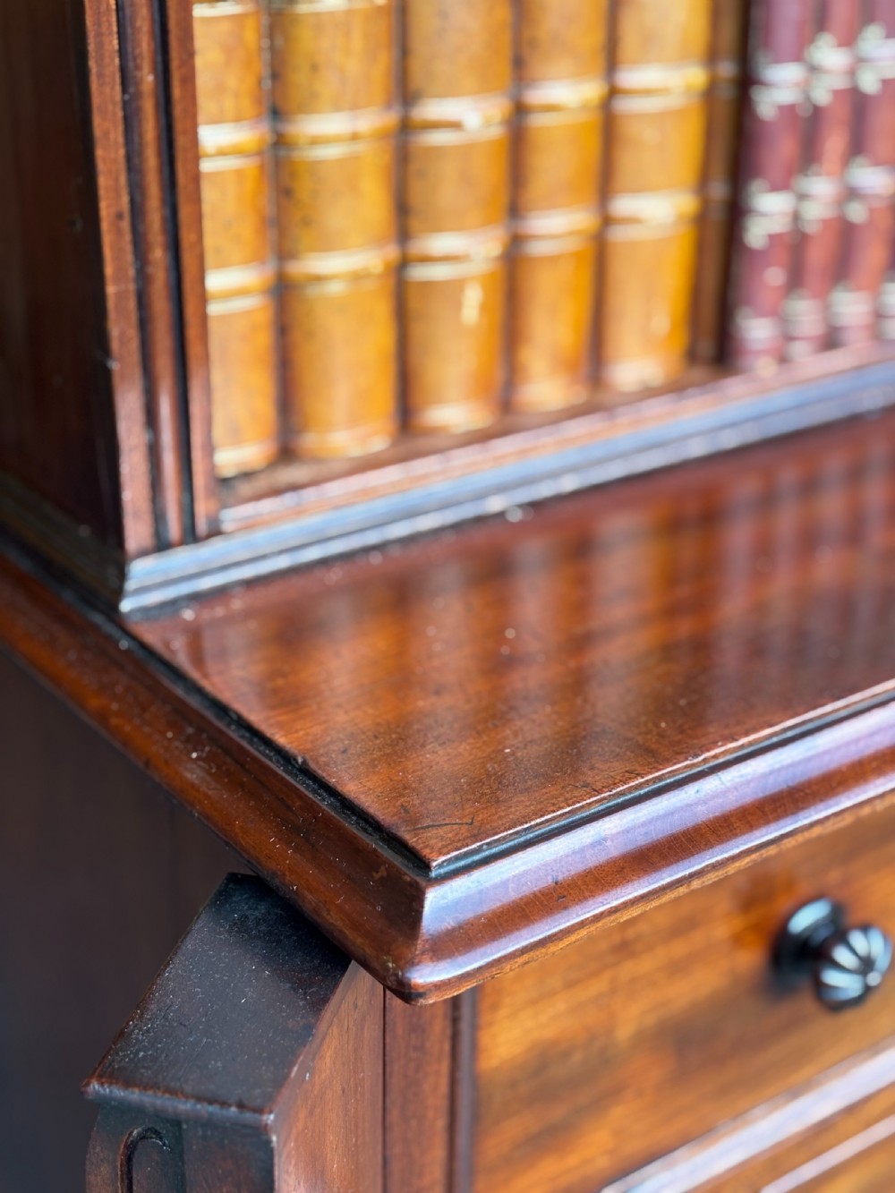 A nineteenth-century mahogany open library bookcase featuring a Wellington chest base with ten small drawers and open adjustable upper shelves. View XI