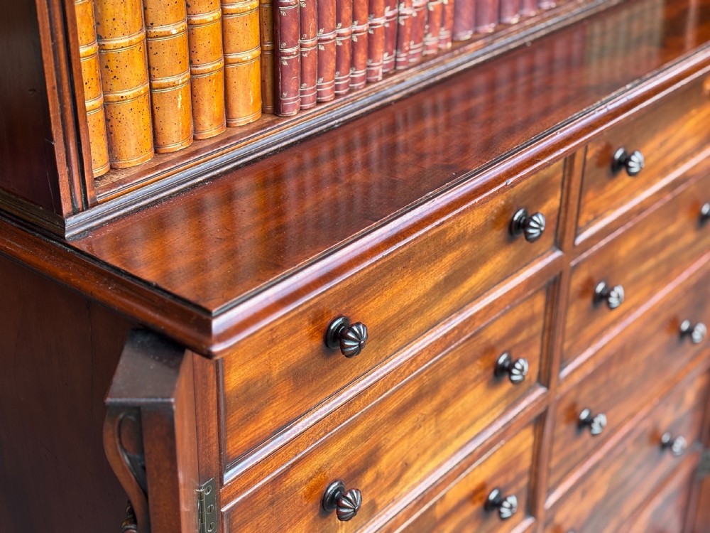 A nineteenth-century mahogany open library bookcase featuring a Wellington chest base with ten small drawers and open adjustable upper shelves. View XII