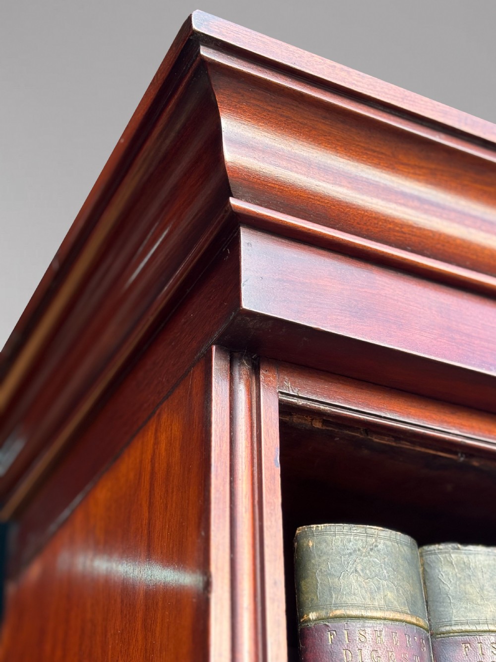 A nineteenth-century mahogany open library bookcase featuring a Wellington chest base with ten small drawers and open adjustable upper shelves. View XVII