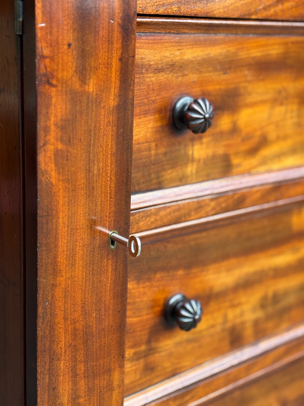A nineteenth-century mahogany open library bookcase featuring a Wellington chest base with ten small drawers and open adjustable upper shelves. View XIX