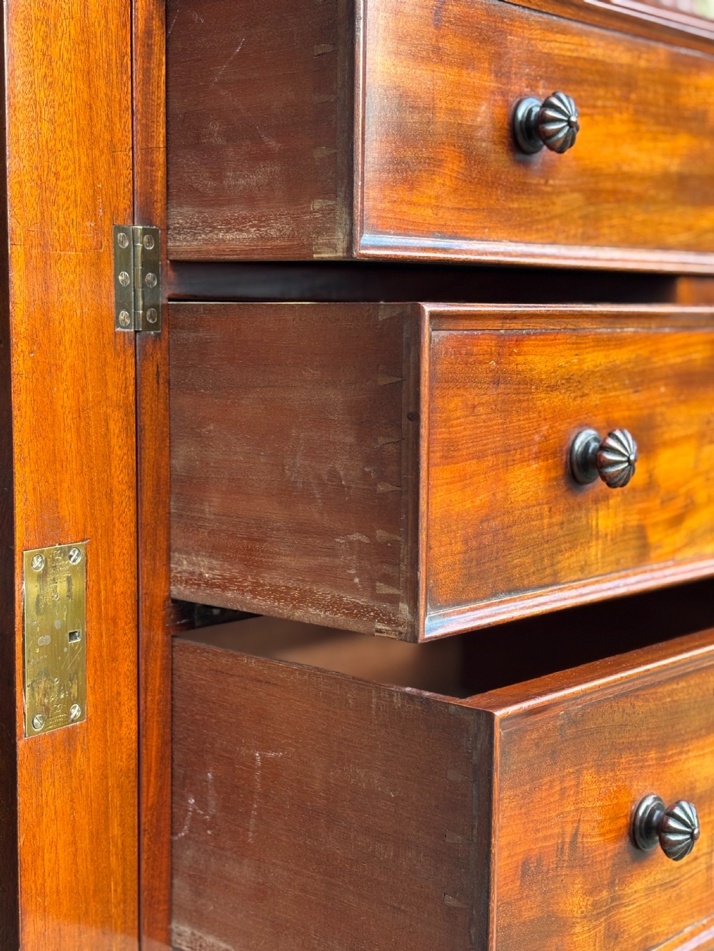 A nineteenth-century mahogany open library bookcase featuring a Wellington chest base with ten small drawers and open adjustable upper shelves. View XX