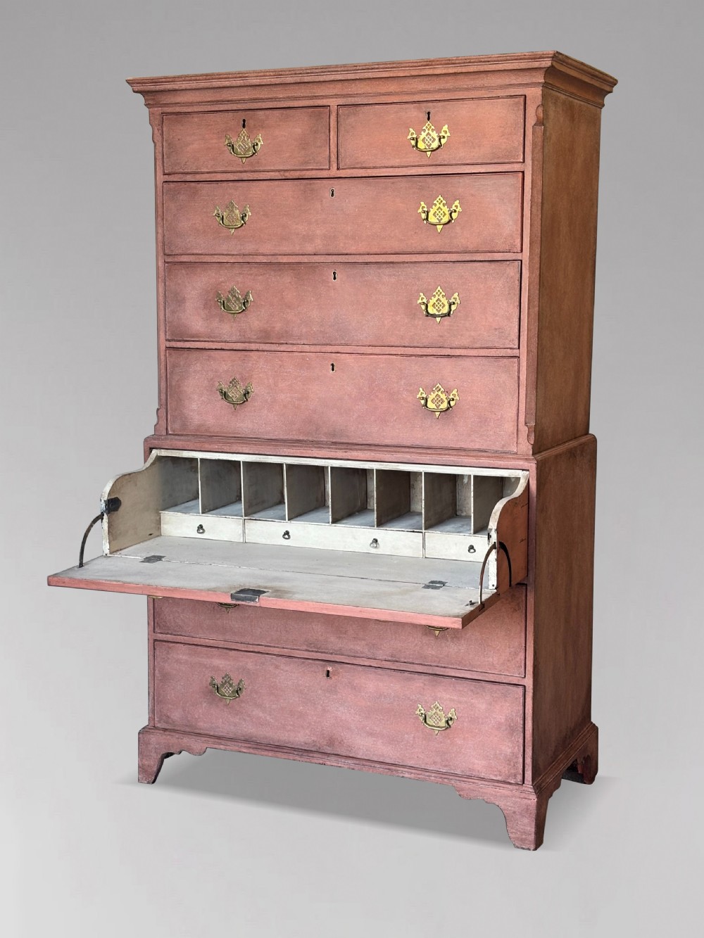 An 18th-century George III painted secretaire tallboy with brass hardware and an open drop-front writing compartment disclosing fitted pigeonholes.