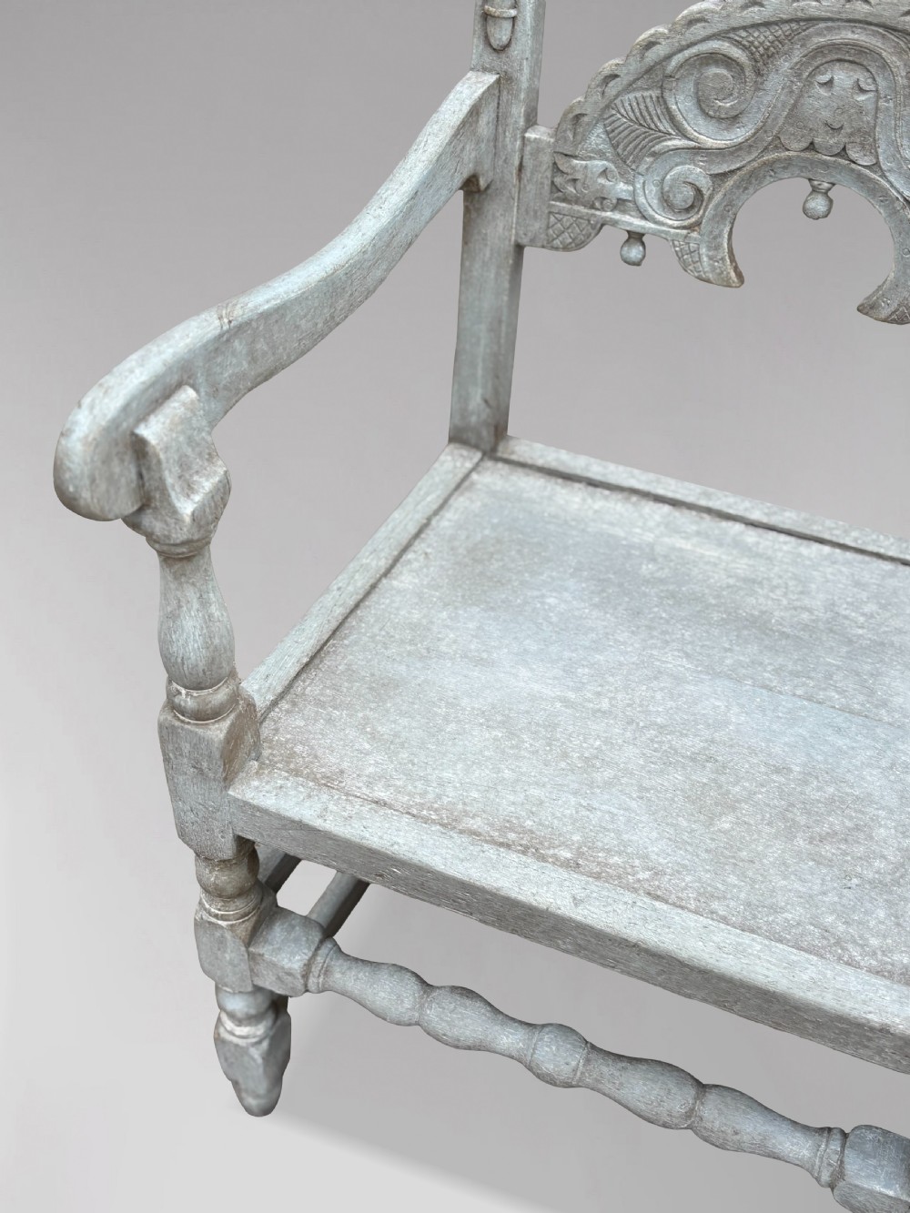A set of eight light grey painted carved oak dining chairs featuring arched openwork backrests and turned legs. View XI