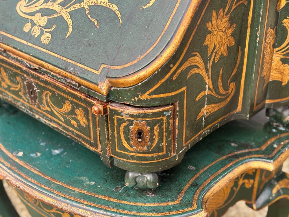 An 18th-century Venetian dark green lacquered travelling bureau with gilded floral scrollwork and fall-front writing flap resting on a matching cabriole-leg stand. View III