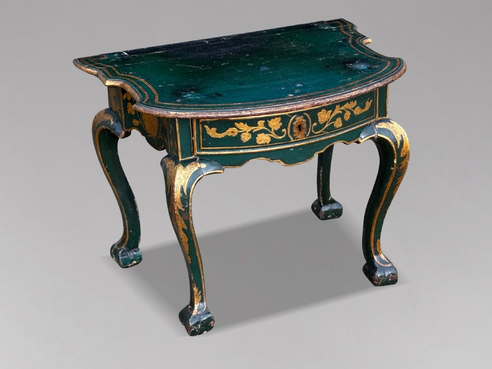 An 18th-century Venetian dark green lacquered travelling bureau with gilded floral scrollwork and fall-front writing flap resting on a matching cabriole-leg stand. View IX
