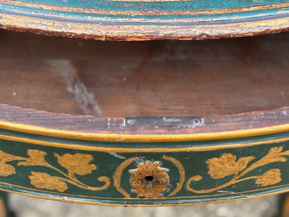 An 18th-century Venetian dark green lacquered travelling bureau with gilded floral scrollwork and fall-front writing flap resting on a matching cabriole-leg stand. View XIV
