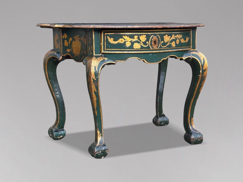 An 18th-century Venetian dark green lacquered travelling bureau with gilded floral scrollwork and fall-front writing flap resting on a matching cabriole-leg stand. View XV
