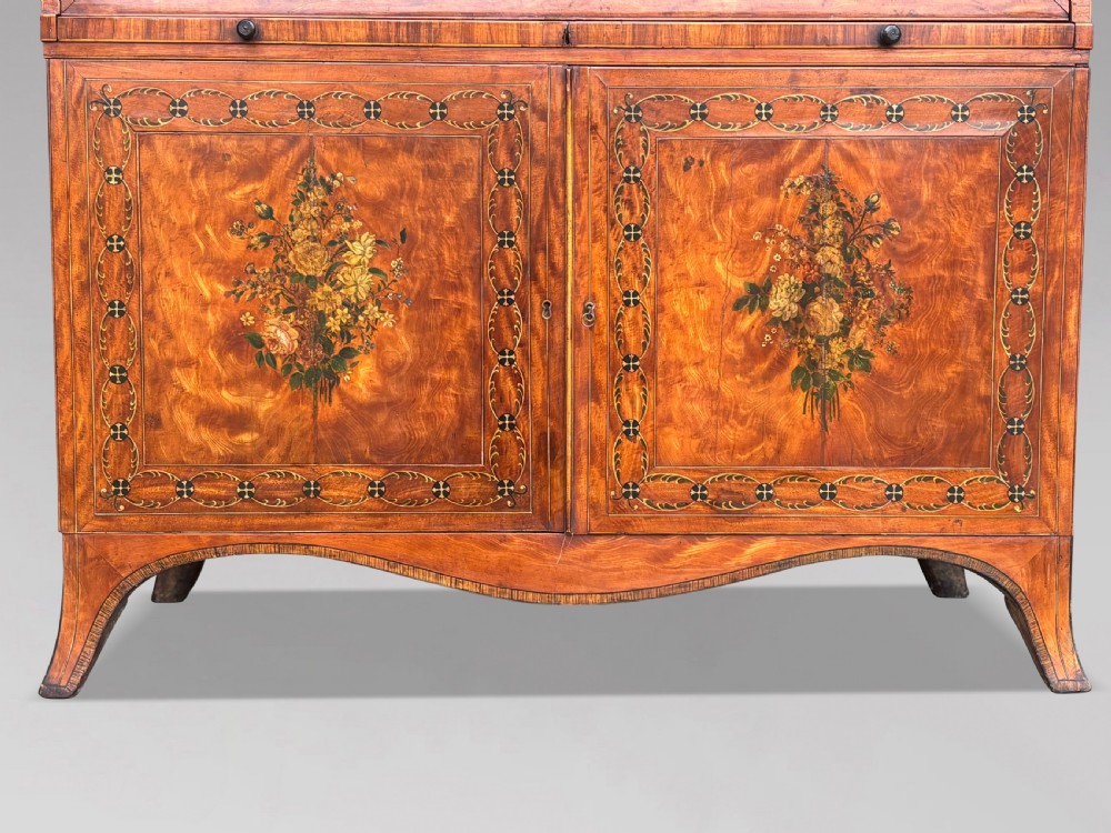 An 18th-century George III satinwood bureau bookcase featuring a glazed upper display cabinet above a cylinder writing section and two inlaid lower doors. View VIII