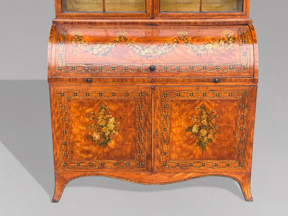 An 18th-century George III satinwood bureau bookcase featuring a glazed upper display cabinet above a cylinder writing section and two inlaid lower doors. View IX