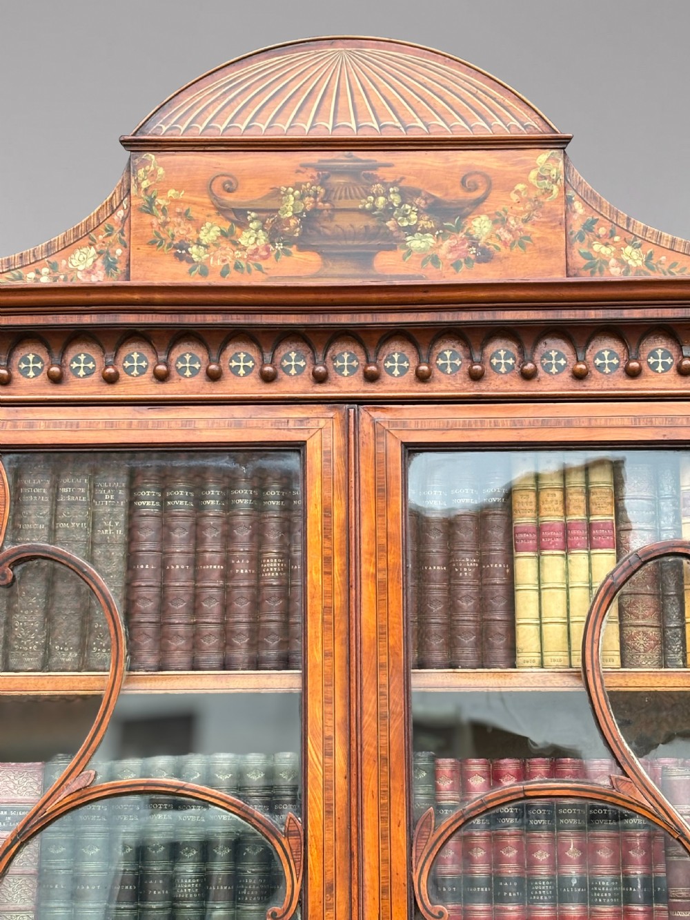 An 18th-century George III satinwood bureau bookcase featuring a glazed upper display cabinet above a cylinder writing section and two inlaid lower doors. View XIV