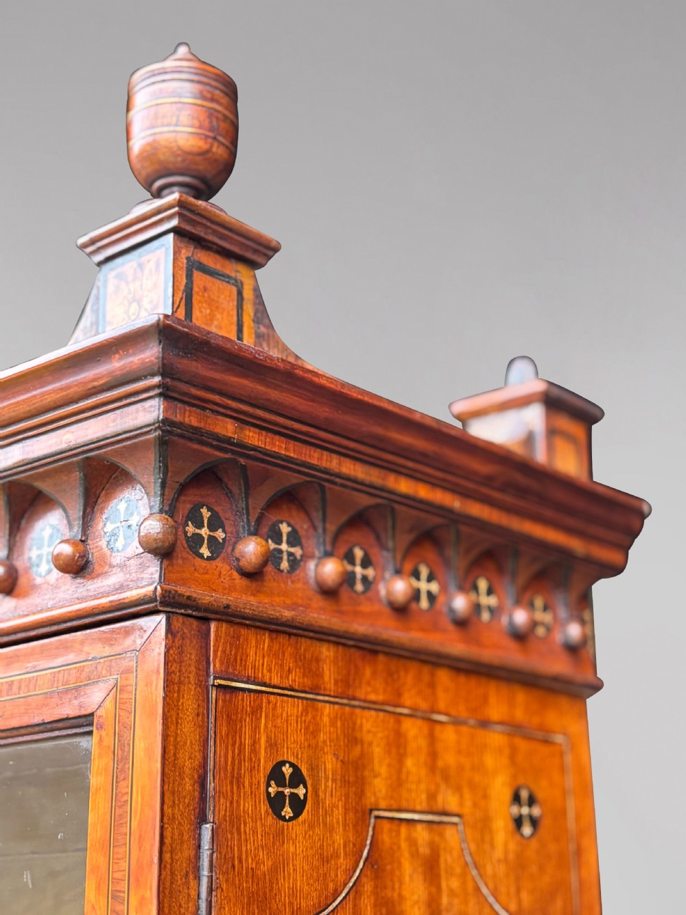 An 18th-century George III satinwood bureau bookcase featuring a glazed upper display cabinet above a cylinder writing section and two inlaid lower doors. View XV