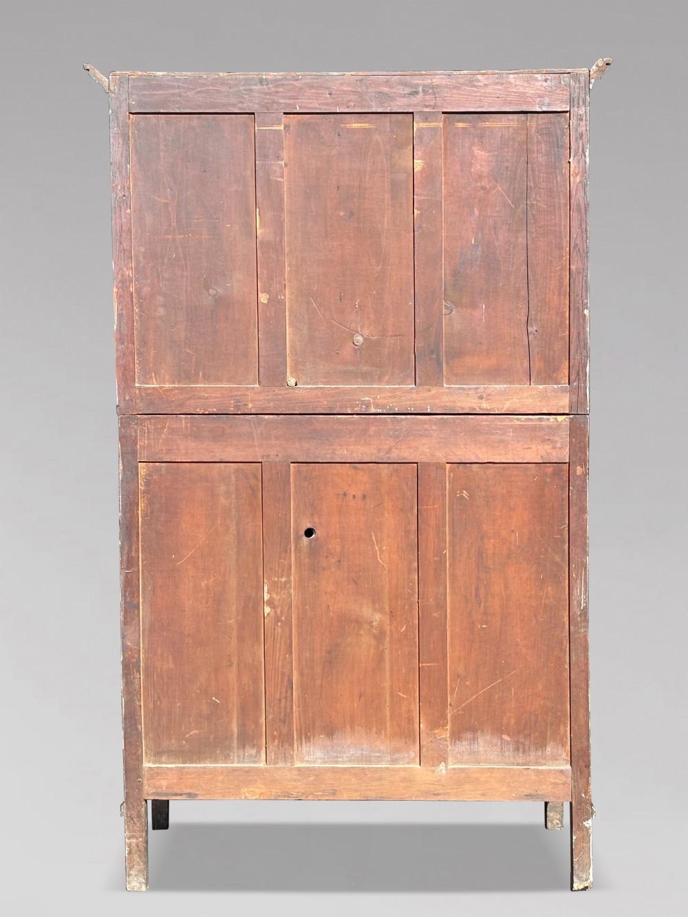 An eighteenth-century George III oak court cupboard featuring an overhanging canopy with turned pendants, upper panelled doors, two drawers, and a double-door base. View X