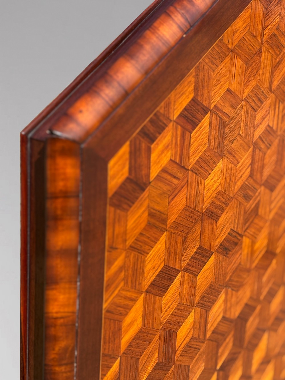 A Victorian walnut tilt-top table featuring an octagonal top decorated with a geometric parquetry pattern, supported by a carved pedestal and tripod legs. View VIII