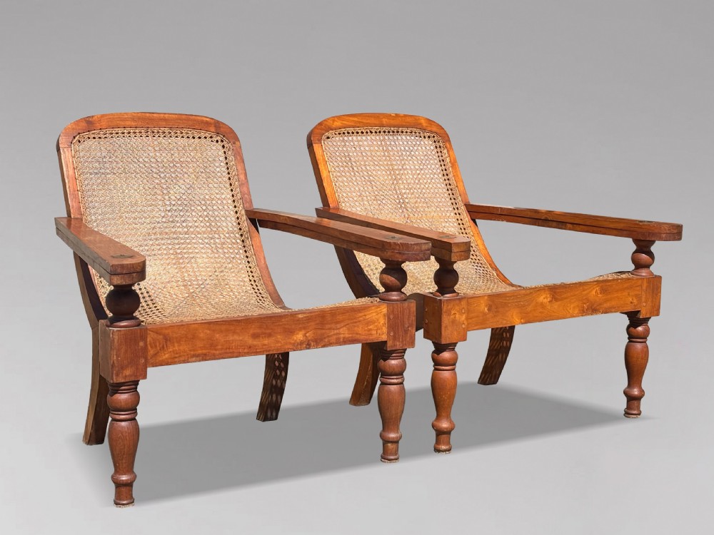 PAIR OF 20TH CENTURY LARGE TEAK & CANE COLONIAL PLANTERS CHAIRS