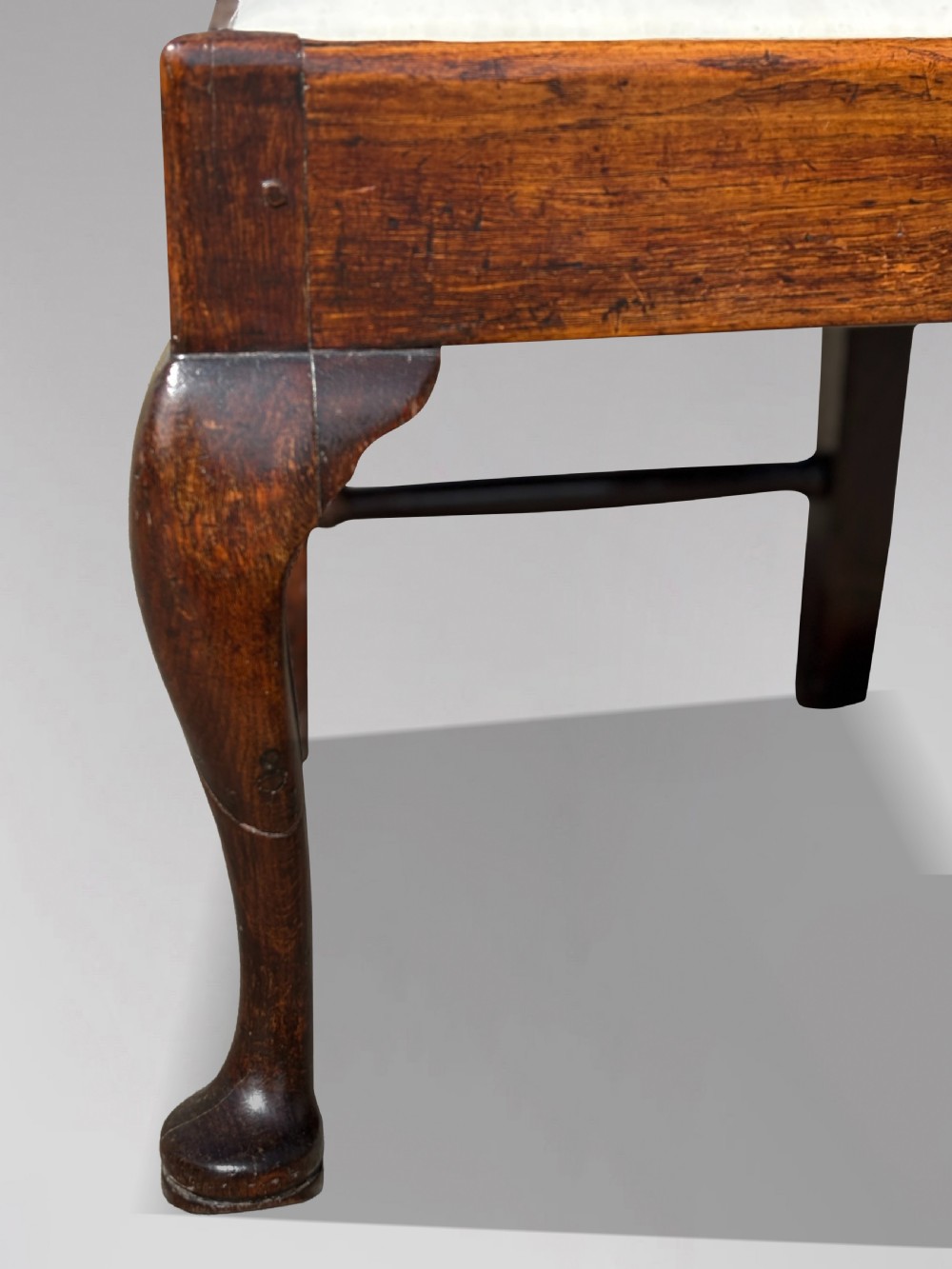 A pair of 18th-century George III oak Chippendale side chairs featuring carved pierced splats, upholstered drop-in seats, and cabriole front legs. View VII