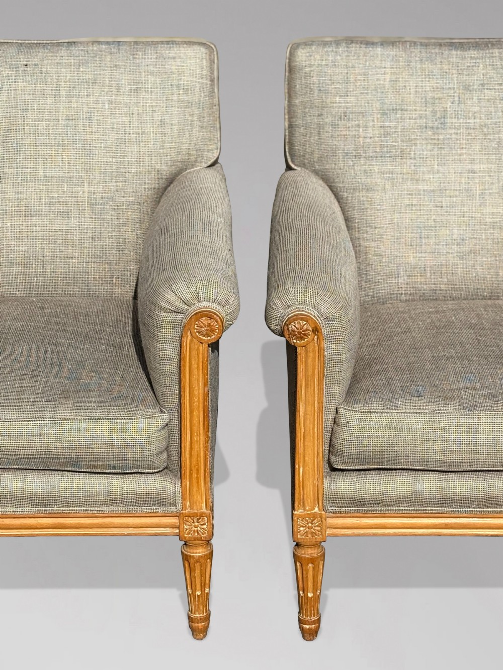 A pair of 19th-century French Louis XVI style armchairs featuring carved wooden frames, fluted legs, and neutral grey woven upholstery. View VII