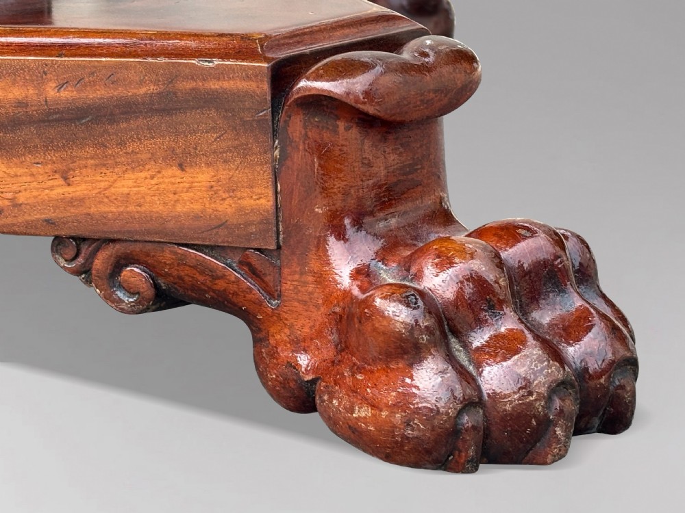 A 19th-century French Charles X mahogany centre table with a circular top, fluted central pedestal, and quadform base on carved feet. View VI