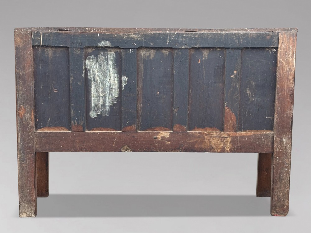 An 18th-century Georgian high-back settle crafted from oak and elm featuring a panelled back and wooden armrests. View VI