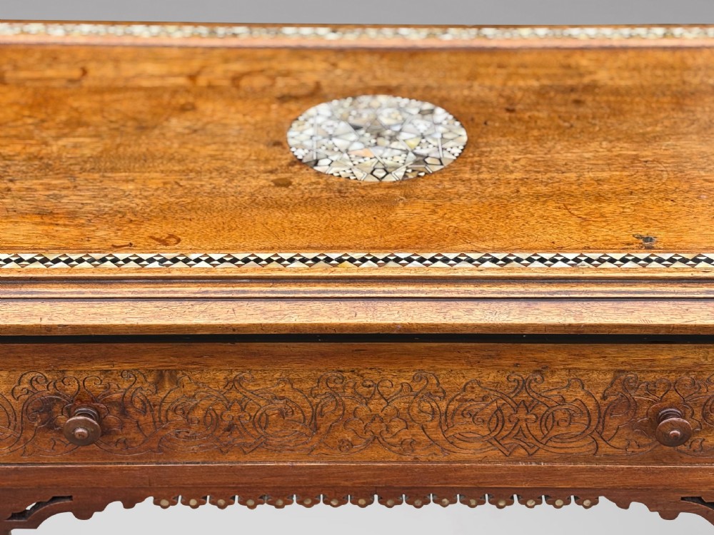 A late 19th-century Aesthetic Movement side table featuring carved wood, a central mother-of-pearl inlay medallion, turned spindle side panels, and turned legs. View XI